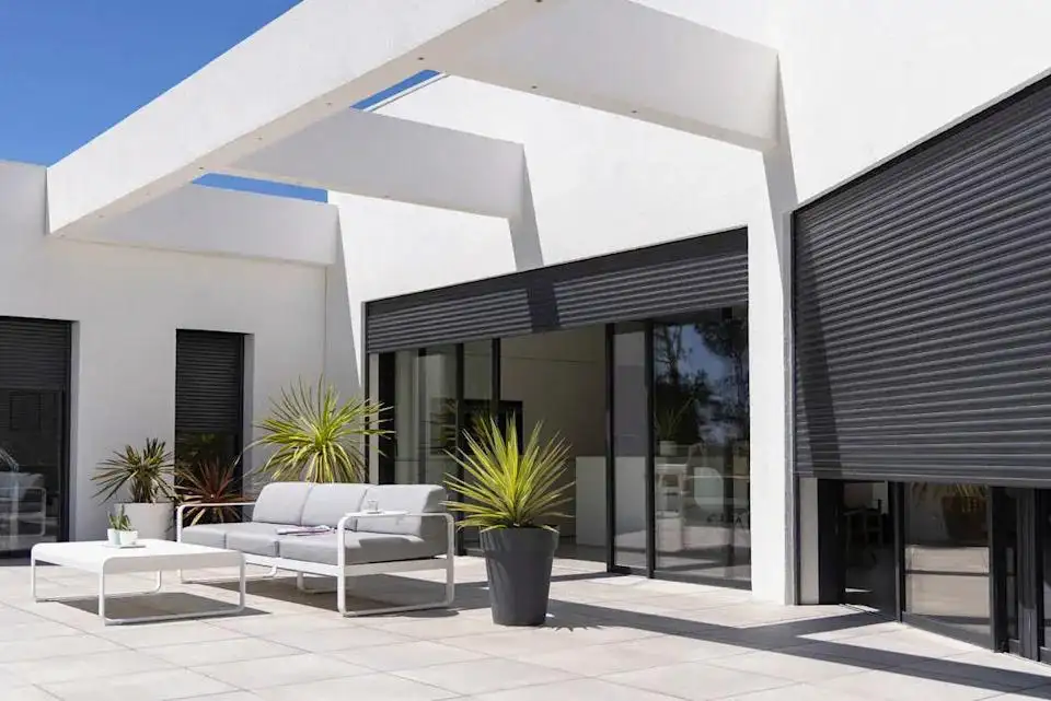 South Florida vacation home prepared for hurricane season with secured windows and patio.
